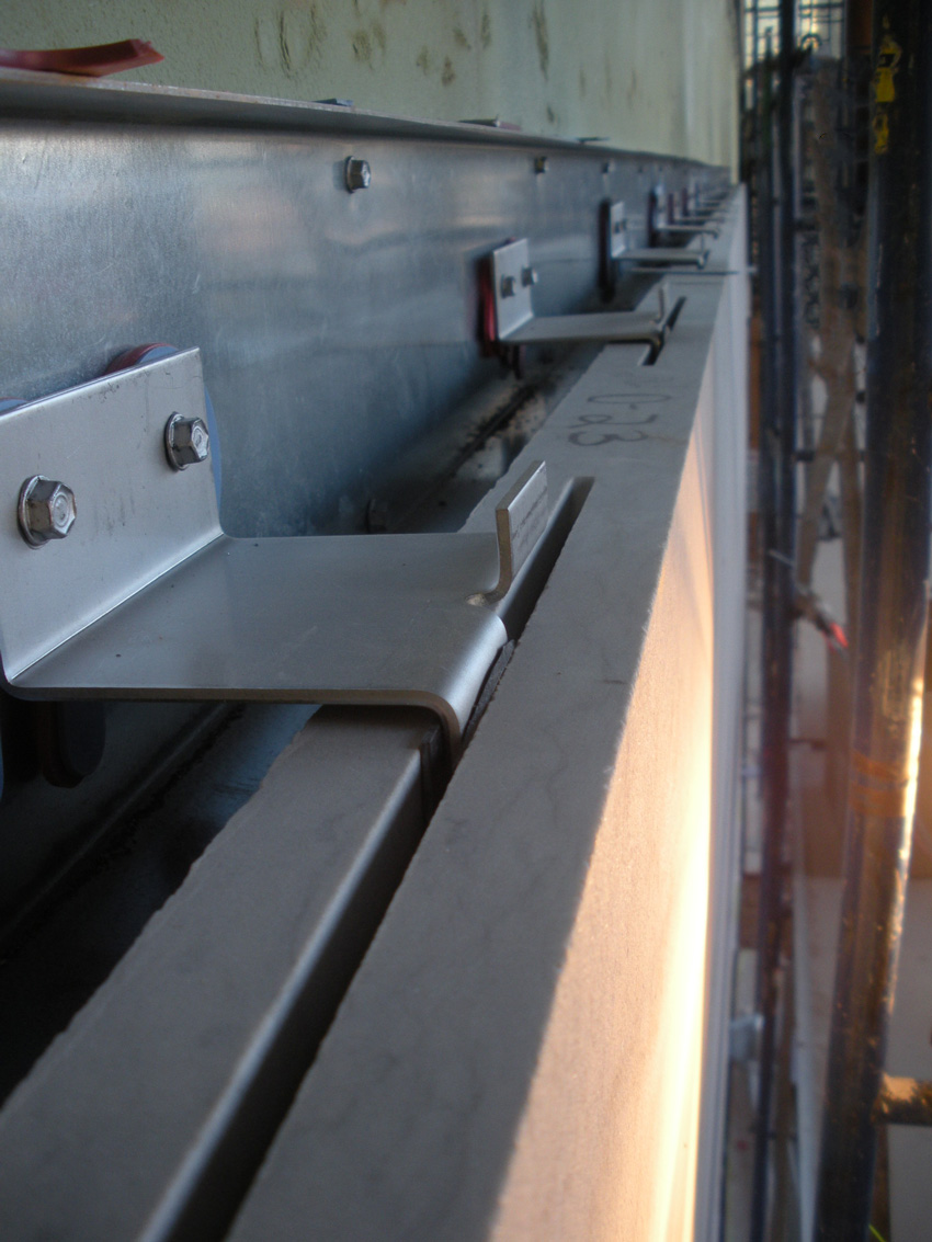 Pictured is an example of bent stainless steel shapes installed in stone cladding.