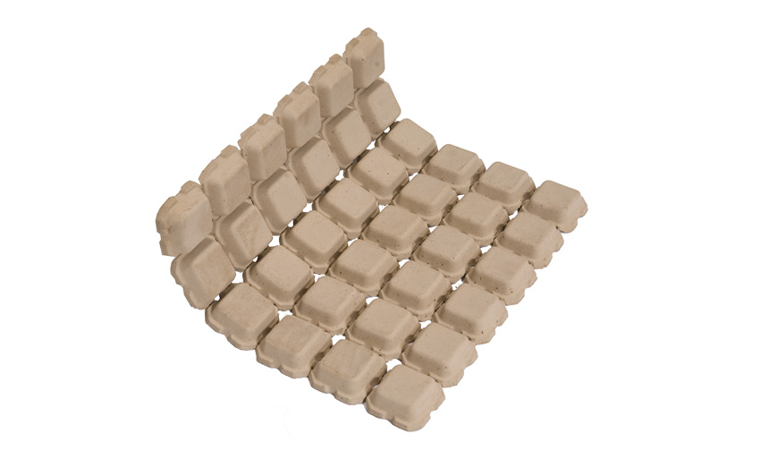 This image shows the flexibility and porous structure of flexible concrete mats.