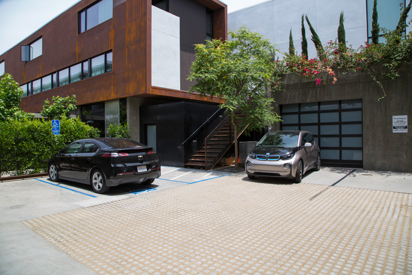Flexible concrete mats provide an attractive permeable parking area at North Parker mixed-use residential project.