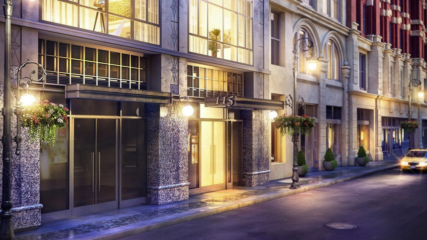 Photo of a street with concrete facade buildings.