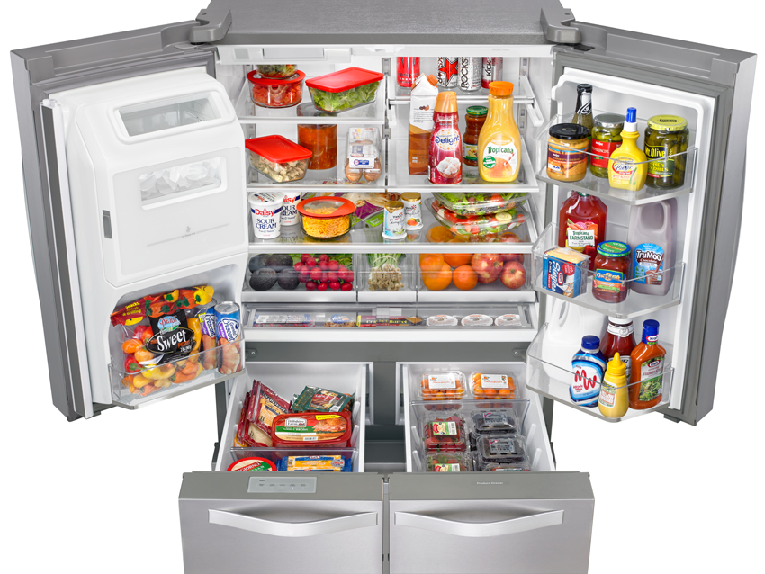 Photo of an open refrigerator with pullout drawers.