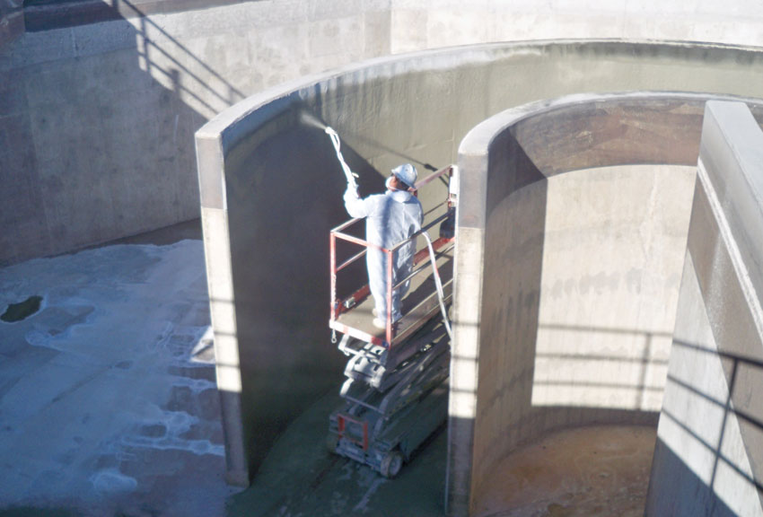 Photo of concrete construction being sprayed.