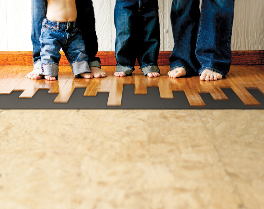 Photo of bare feet on wood floors.