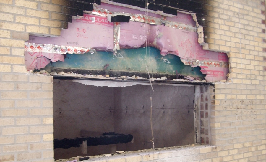 Figure 9:  Wall Showing Limited Fire Spread After Brick Veneer Has Been Stripped.