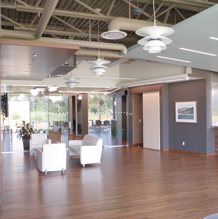 Photo of an interior with ceiling mounted acoustic panels.