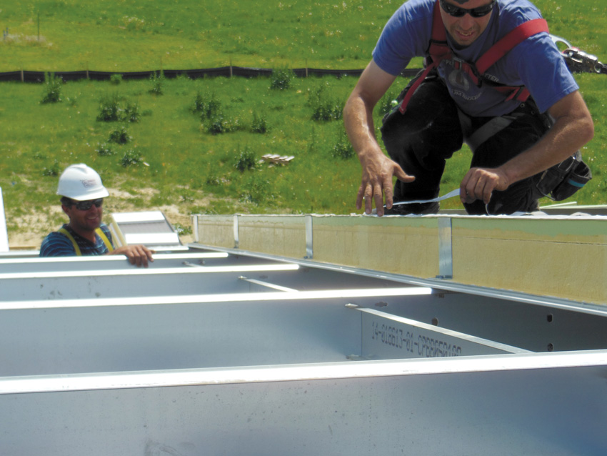 Photo of workers applying a seal system.