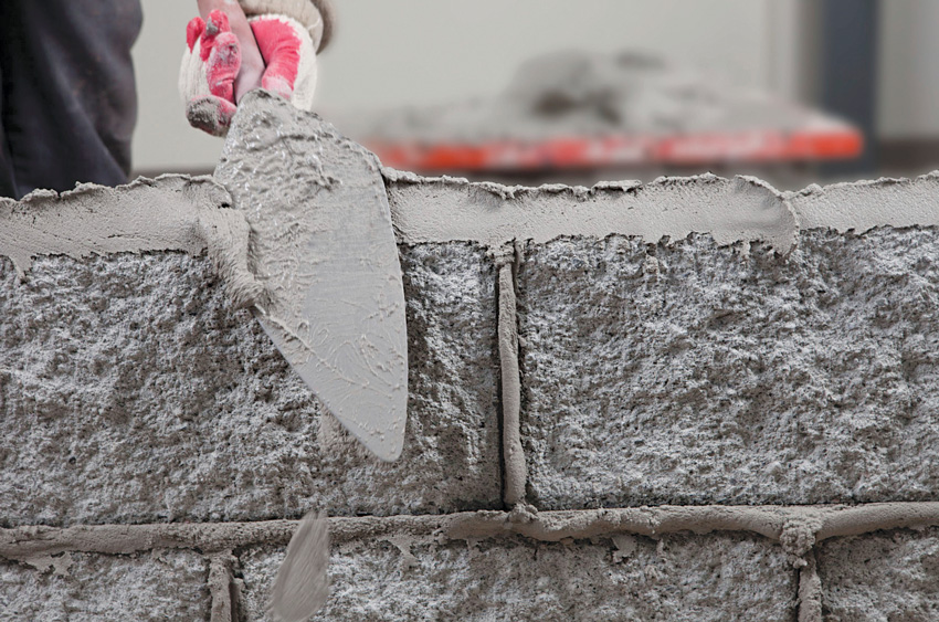 Photo of mortar being applied to masonry.