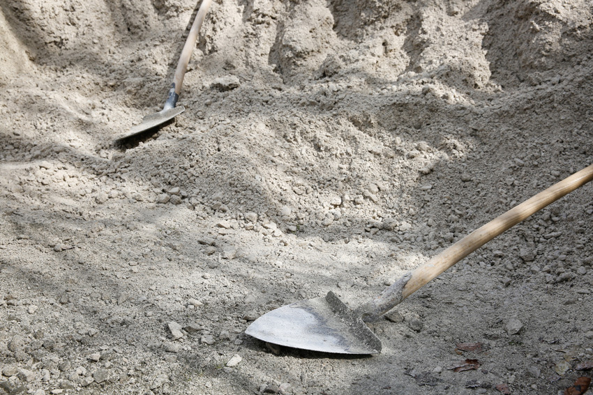 Photo of sand and shovels.
