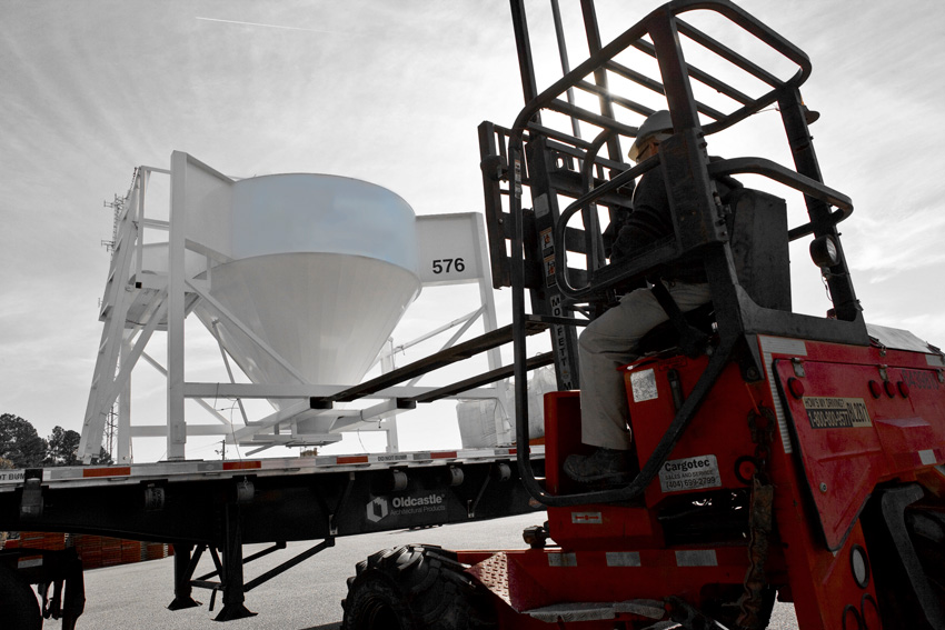 Photo of a forklift and on-site mixer.