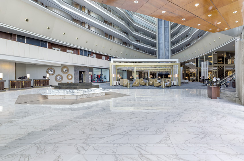 Photo of a lobby with a stone floor.