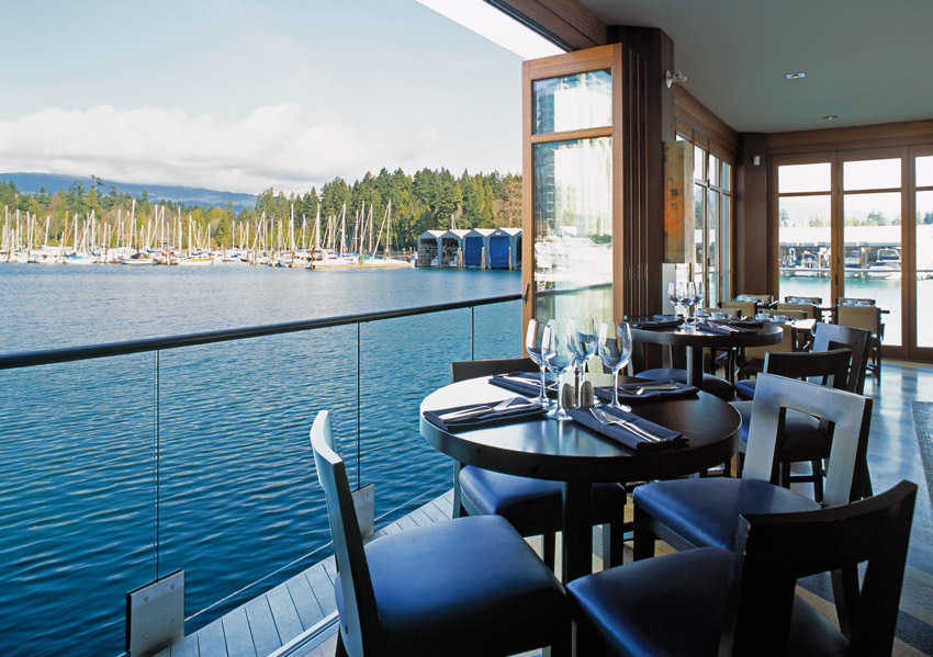 Photo of a restaurant on a waterfront.