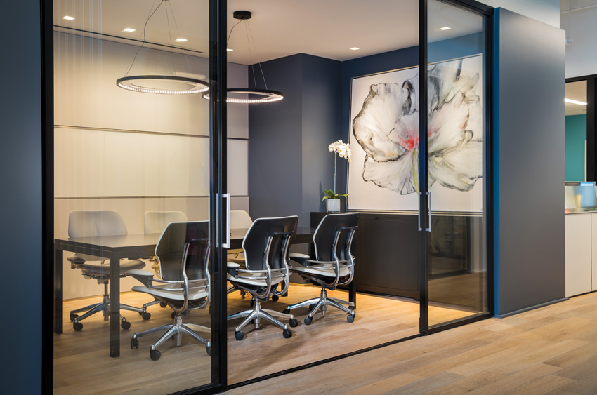 Photo of a conference room with glass partition walls.