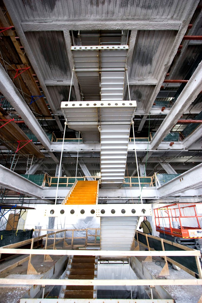 Pictured is the interior steel stairway hanging from the new construction above Blue Cross Blue Shield’s vertical expansion.
