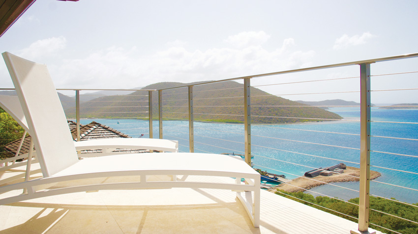 A stainless steel cable railing system provides panoramic views from this outdoor deck.