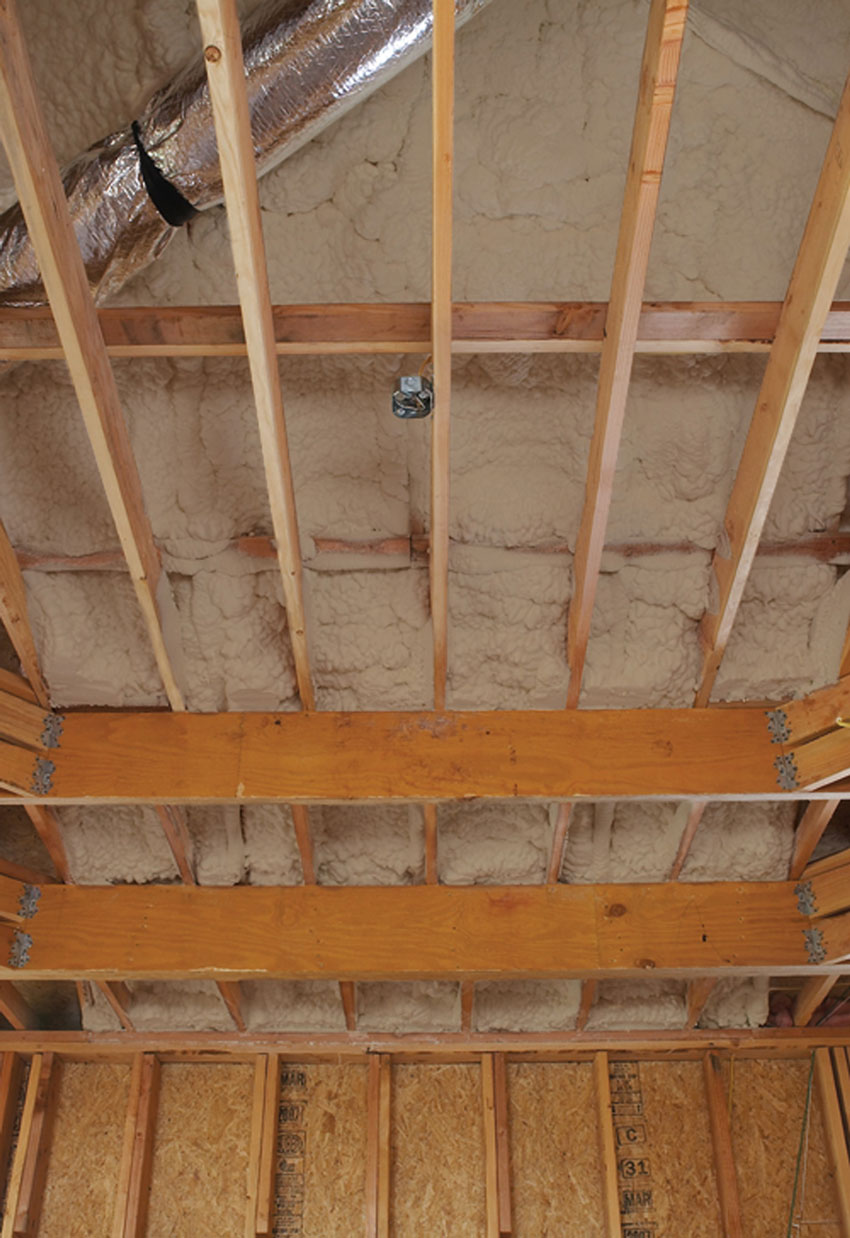 Photo of a ceiling under construction with insulation in the ceiling.