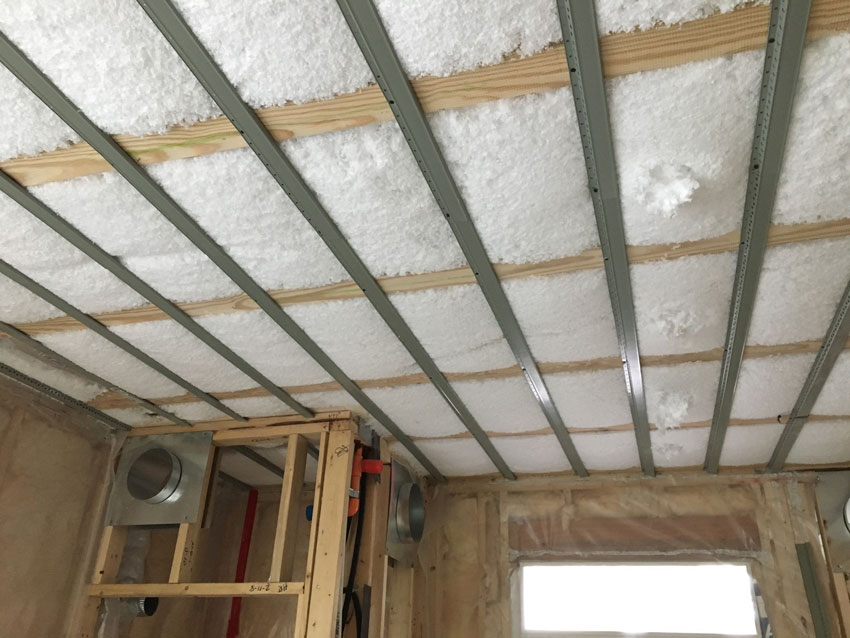 Photo of a ceiling with insulation under constrution.