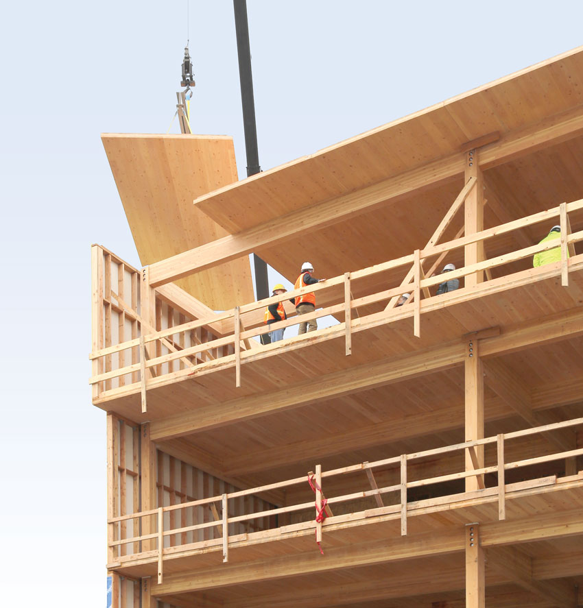 Photo of a wood fraem building under construction.