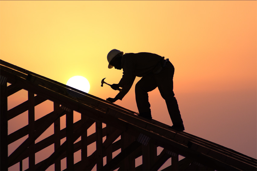 Construction worker on roof.