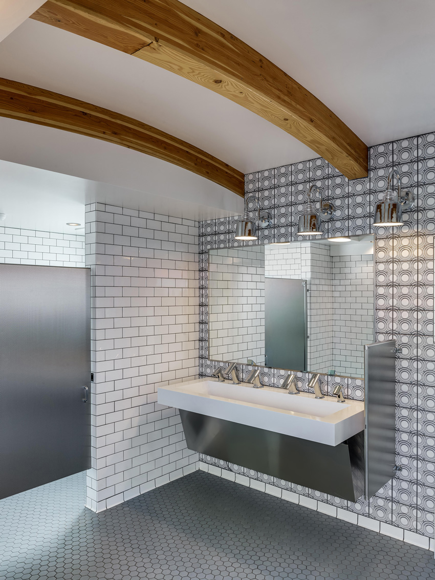 Photo of restroom with deck-mounted hand dryers.