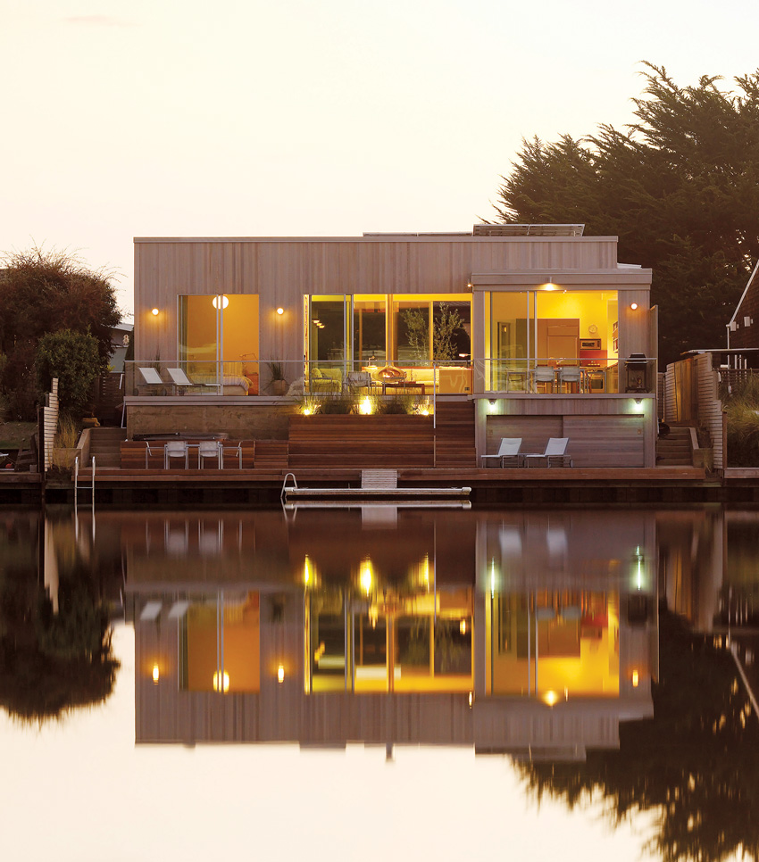 Photo of red cedar siding of a lakehouse.