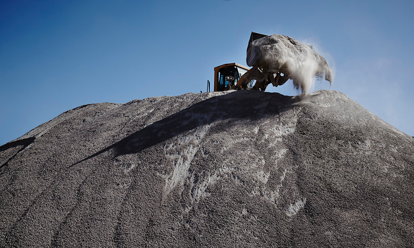 Bulldozer on a hill of stone rubble